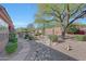 Landscaped backyard with stone pathway and desert plants at 12238 E Poinsettia Dr, Scottsdale, AZ 85259