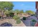 Landscaped backyard oasis with a pool and patio area at 12238 E Poinsettia Dr, Scottsdale, AZ 85259