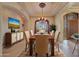 Elegant dining room featuring a large table and chandelier at 12238 E Poinsettia Dr, Scottsdale, AZ 85259