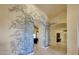 Elegant entryway with painted mural and arched hallways at 12238 E Poinsettia Dr, Scottsdale, AZ 85259