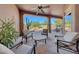 Relaxing covered patio with seating and pool views at 12238 E Poinsettia Dr, Scottsdale, AZ 85259