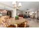 Dining area with a round table, looking into the living room at 12923 W Ballad Dr, Sun City West, AZ 85375