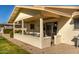 Covered patio with seating area, overlooking the backyard at 12923 W Ballad Dr, Sun City West, AZ 85375