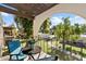 Private balcony with seating and views of trees at 131 N Higley Rd # 213, Mesa, AZ 85205