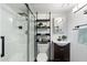 Modern bathroom with glass shower, floating shelves and dark vanity at 131 N Higley Rd # 213, Mesa, AZ 85205