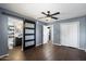 Main bedroom with sliding barn door to bathroom and walk-in closet at 131 N Higley Rd # 213, Mesa, AZ 85205