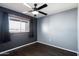 Simple bedroom with dark wood floors and window at 131 N Higley Rd # 213, Mesa, AZ 85205