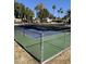 Community tennis court with chain link fence at 131 N Higley Rd # 213, Mesa, AZ 85205