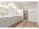 Elegant bathroom with dual sinks, gray cabinets, and a walk-in shower at 1326 W Seascape Dr, Gilbert, AZ 85233