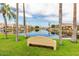 Waterfront view with bench and palm trees at 1326 W Seascape Dr, Gilbert, AZ 85233