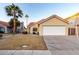 House exterior featuring a two-car garage and desert landscaping at 1326 W Seascape Dr, Gilbert, AZ 85233