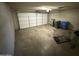 Garage with overhead door, ample space for vehicles and storage at 14017 N 40Th Ave, Phoenix, AZ 85053