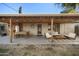 Covered patio with dining table and comfortable seating area at 1432 E Lupine Ave, Phoenix, AZ 85020