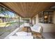 Relaxing covered patio features modern furniture and wood ceiling at 1432 E Lupine Ave, Phoenix, AZ 85020