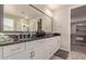 Modern bathroom with double vanity and large mirror at 15130 W Linden St, Goodyear, AZ 85338