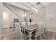 Bright dining room featuring a rustic farmhouse table and chairs at 15130 W Linden St, Goodyear, AZ 85338