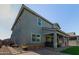 Two-story house exterior with a covered patio and hot tub at 15130 W Linden St, Goodyear, AZ 85338