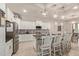 Modern kitchen with white cabinets, granite counters, and stylish light fixtures at 15130 W Linden St, Goodyear, AZ 85338