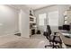 Home office with built-in shelving and desk at 15130 W Linden St, Goodyear, AZ 85338