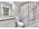 Bathroom featuring granite countertop and marble shower curtain at 15202 N 26Th St, Phoenix, AZ 85032