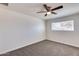 Bright bedroom with carpet flooring and ceiling fan at 15202 N 26Th St, Phoenix, AZ 85032