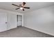 Bedroom with ceiling fan and built-in closet at 15202 N 26Th St, Phoenix, AZ 85032