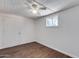 Bedroom with wood-look flooring and ceiling fan at 15202 N 26Th St, Phoenix, AZ 85032