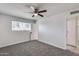 Bedroom with window, ceiling fan and carpet at 15202 N 26Th St, Phoenix, AZ 85032