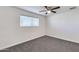 Bedroom featuring a window with blinds and ceiling fan at 15202 N 26Th St, Phoenix, AZ 85032