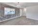 Dining room features a brick accent wall and tile floors at 15202 N 26Th St, Phoenix, AZ 85032