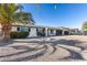 Charming single story home with a two car garage and palm trees at 15202 N 26Th St, Phoenix, AZ 85032