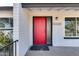 Red front door entry with a modern black accent at 15202 N 26Th St, Phoenix, AZ 85032