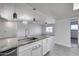 Kitchen island with granite countertop and stainless steel sink at 15202 N 26Th St, Phoenix, AZ 85032