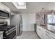 Modern kitchen with stainless steel appliances and granite counters at 15202 N 26Th St, Phoenix, AZ 85032