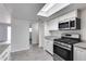 Modern kitchen with white cabinets and granite countertops at 15202 N 26Th St, Phoenix, AZ 85032