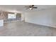 Bright and airy living area with tile floors and brick accent wall at 15202 N 26Th St, Phoenix, AZ 85032