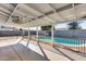 Covered patio overlooking a sparkling pool at 15202 N 26Th St, Phoenix, AZ 85032