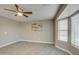 Spacious bedroom with bay window and ceiling fan at 1633 S 171St Dr, Goodyear, AZ 85338