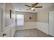 Charming bedroom with wainscoting and ceiling fan at 1633 S 171St Dr, Goodyear, AZ 85338