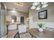 Kitchen dining area with wood table and modern lighting at 1633 S 171St Dr, Goodyear, AZ 85338