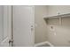 Convenient laundry room with shelving and hookups at 1633 S 171St Dr, Goodyear, AZ 85338