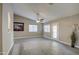 Living room with tile floors, ceiling fan and patio access at 1633 S 171St Dr, Goodyear, AZ 85338