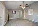 Living room with tile floors, ceiling fan and access to patio at 1633 S 171St Dr, Goodyear, AZ 85338