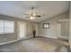 Spacious living room with tile floors and ceiling fan at 1633 S 171St Dr, Goodyear, AZ 85338