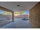 Relaxing covered patio overlooking a sparkling pool at 1633 S 171St Dr, Goodyear, AZ 85338