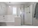 Bathroom with a shower and a bathtub at 17338 W Woodrow Ln, Surprise, AZ 85388