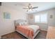 Cozy bedroom with a comfortable bed and large window at 17338 W Woodrow Ln, Surprise, AZ 85388