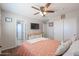 Charming bedroom with floral bedding and a dresser at 17338 W Woodrow Ln, Surprise, AZ 85388