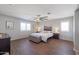 Main bedroom with wood floors and a plush bed at 17338 W Woodrow Ln, Surprise, AZ 85388