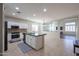 Kitchen with white cabinets, granite countertops, and an island at 17338 W Woodrow Ln, Surprise, AZ 85388